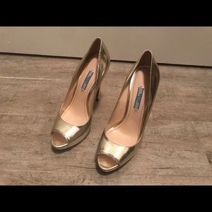 Gold prada peep toe pumps
